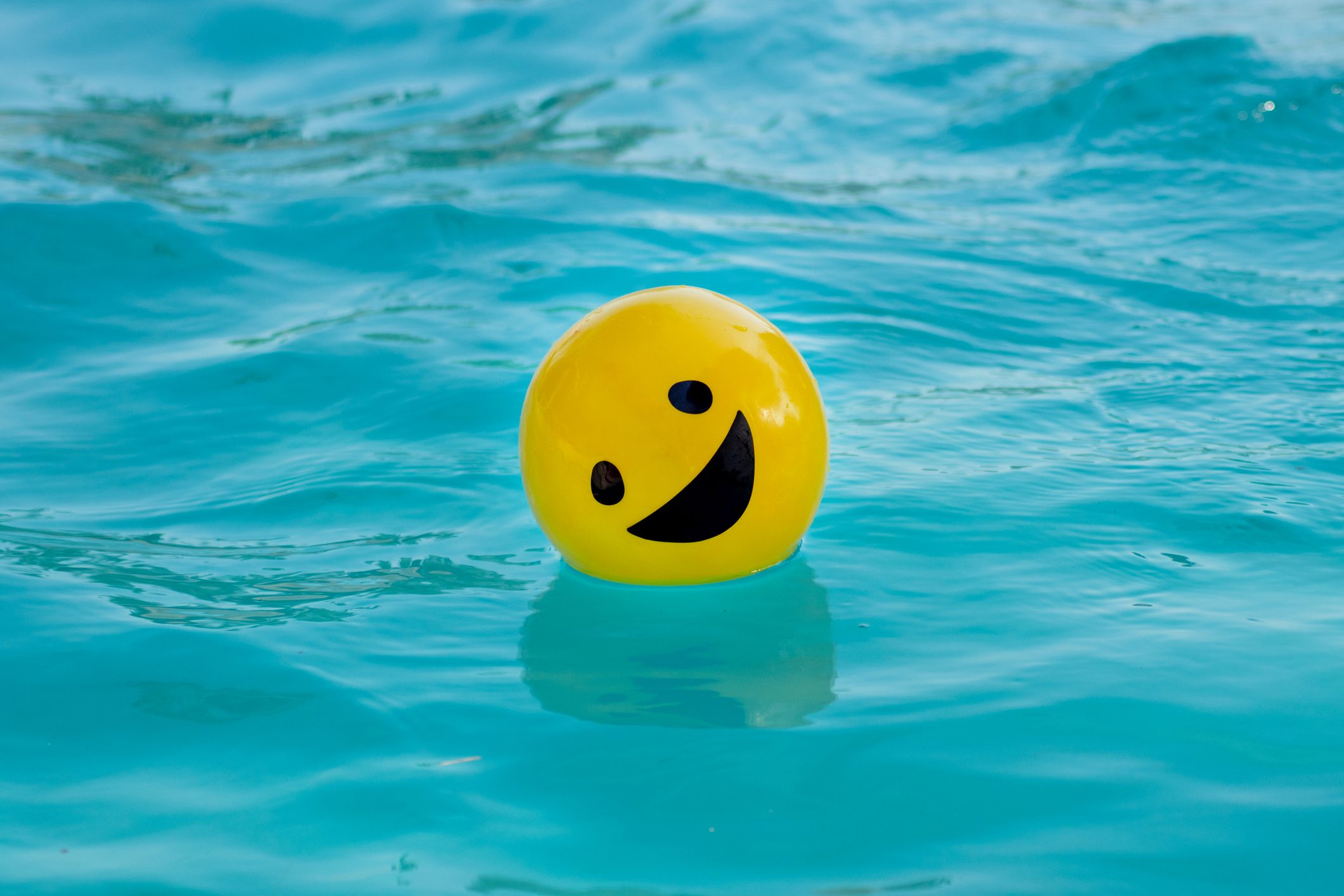 Picture Prompts: Happy Ball Yellow ball with a smiling face floating on the swimming pool